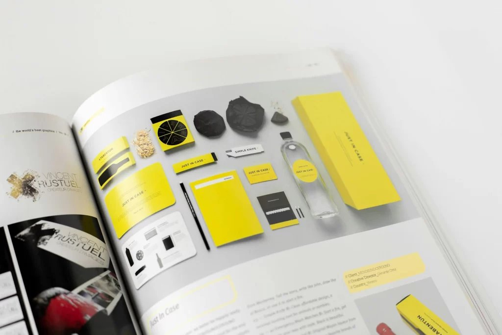 Book with yellow and black pages, featuring branding.