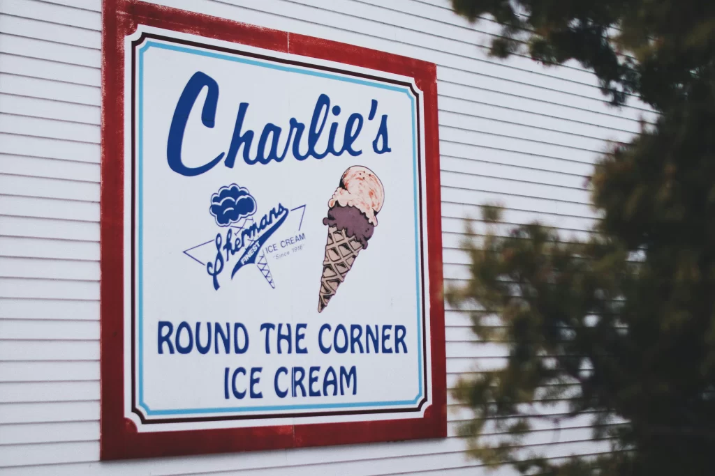 Charlie's" ice cream shop, featuring a picture of a large ice cream cone and the words "Round the Corner Ice Cream