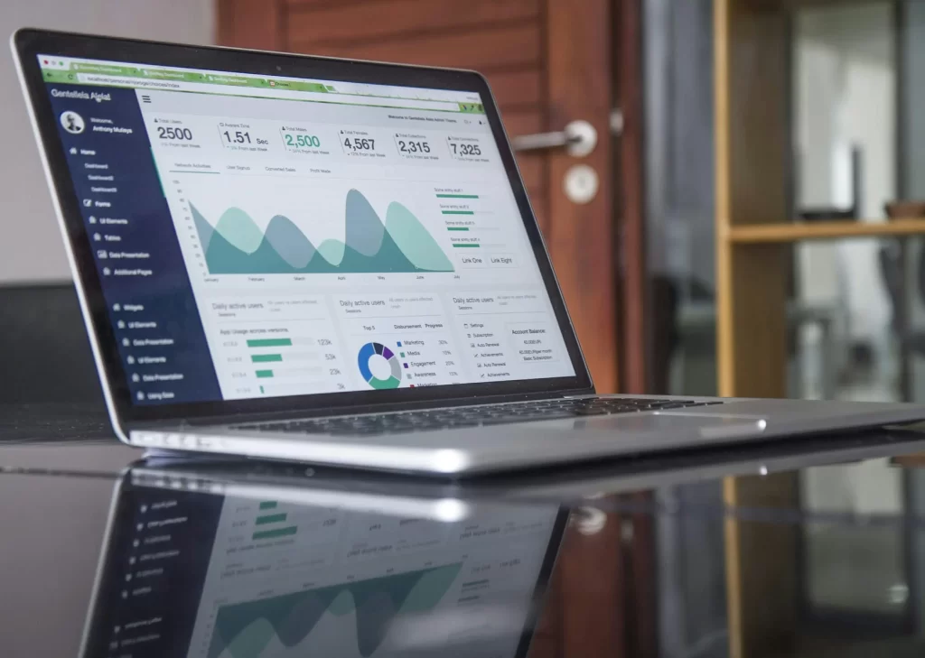 A laptop screen showing data analysis of a website’s traffic. 