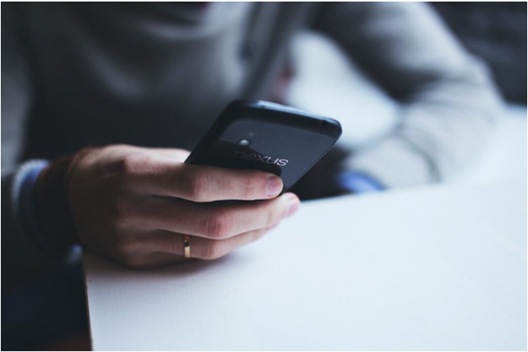 A man holding a cellphone